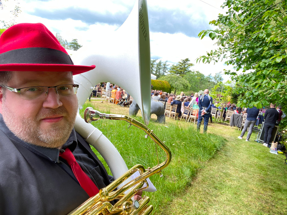 Sousaphone at a wedding outside.